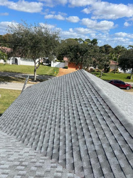 Dumaster Roofing — Long ridge line of a freshly installed shingle roof