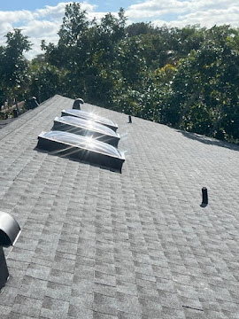 Dumaster Roofing — Shingle roof with newly installed skylights and flashing