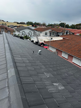 Dumaster Roofing — Completed flat tile roof replacement on a South Florida home